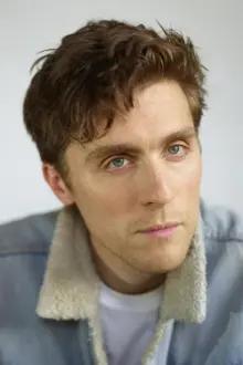 Jack Farthing como: The Young Man