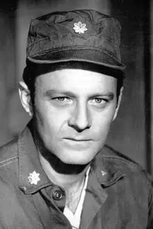 Larry Linville como: Archive footage