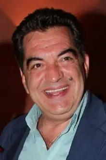 Kostas Evripiotis como: John Travolta
