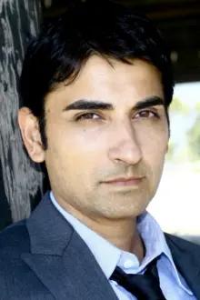 Akbar Kurtha como: Ahmad (segment "London")