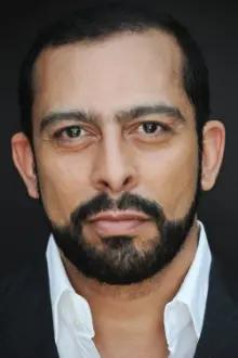 Emilio Doorgasingh como: Executioner / Malik Jiwan / Qazi Sayed