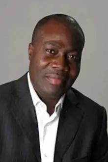 Sylvestre Amoussou como: Boubacar Godmey / Koffi Godomey