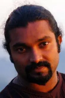 Jijoy Rajagopal como: Mani, Siddharathan's brother