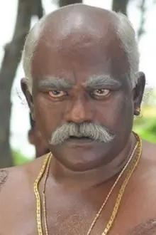 'Poo' Ram como: Kamalakkannan's Father