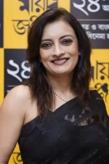Ushasie Chakraborty como: June Guha