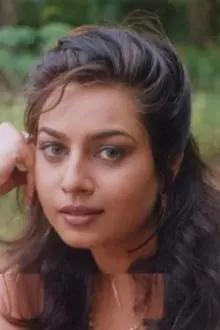 Ruchita Prasad como: Radhika Menon